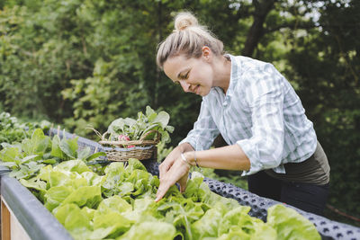 Woman holding food on plant