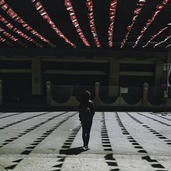 Full length of woman standing in amusement park