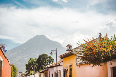 Houses and buildings against sky