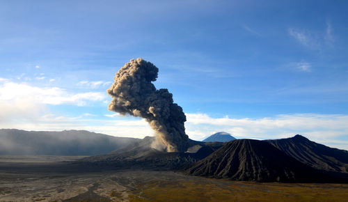 Scenic view of volcanic mountain against sky