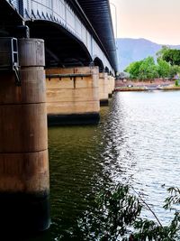 Bridge over river against sky