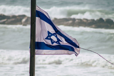 Close-up of flag against the sky