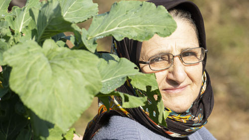 Portrait of woman wearing eyeglasses standing outdoors