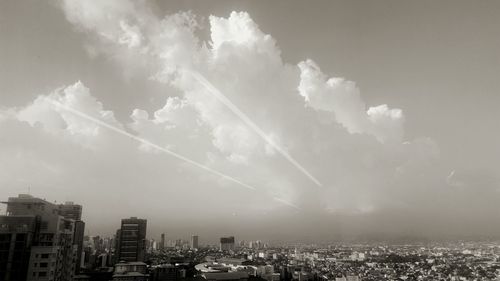 Aerial view of cityscape against sky