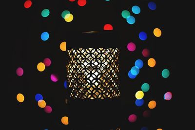 Low angle view of illuminated lights at night