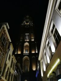 Low angle view of illuminated city at night