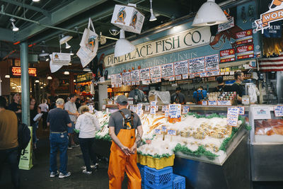 People walking on street market in city