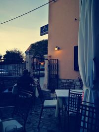 Rear view of two people sitting in restaurant