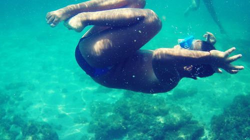 High angle view of man swimming in sea