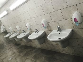 Bathroom sinks and soap dispensers in restroom