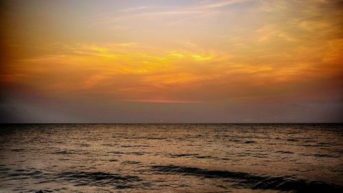 Scenic view of sea at sunset