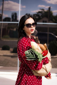 Portrait of young woman wearing sunglasses