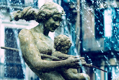 Close-up of statue against trees during winter