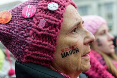 Close-up portrait of woman with pink hat