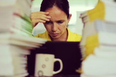 Stressful woman working in office