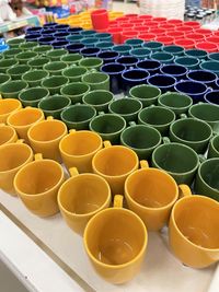 High angle view of multi colored bottles on shelf