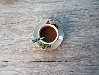 High angle view of coffee cup on table