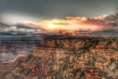 View of rock formation on landscape against sky during sunset