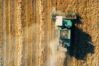 Aerial view of combine harvester on agricultural field
