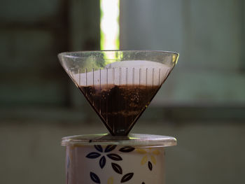 Close-up of coffee on glass table