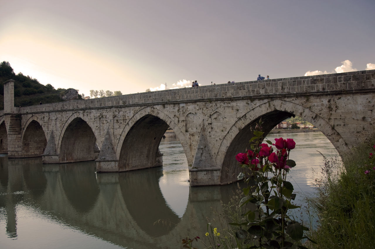 ARCH BRIDGE AGAINST SKY DURING SUNSET