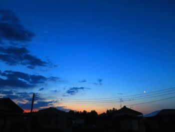 Low angle view of buildings against sky at sunset