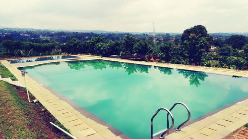 High angle view of swimming pool against sky