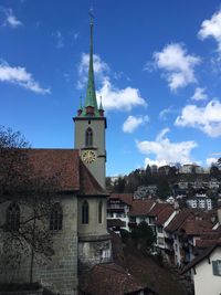 Buildings in town against sky