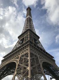 Low angle view of tower against cloudy sky