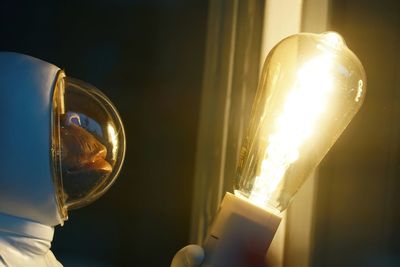 Close-up of illuminated light bulb