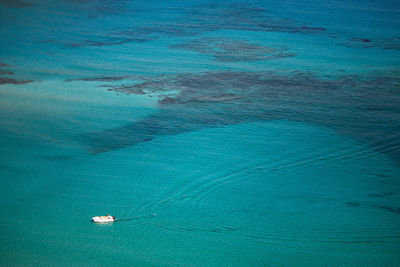 High angle view of sailboat in sea