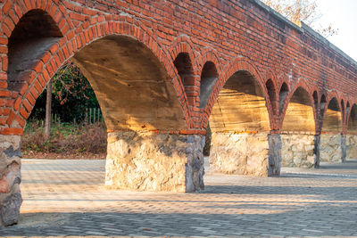 An ancient red arch bridge