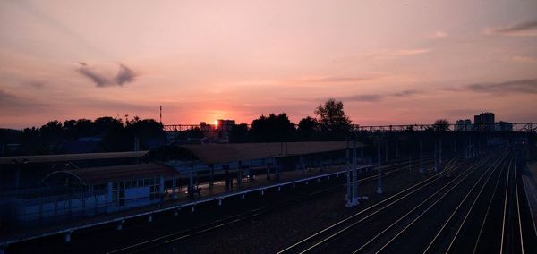 High angle view of railroad tracks against sky during sunset