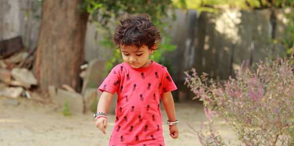 Boy standing on field