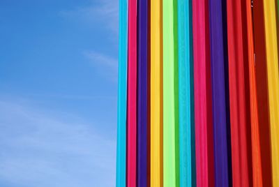 Colorful umbrellas against blue sky