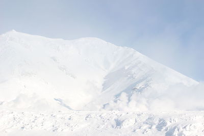 Snow covered mountains against sky