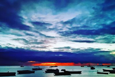 Scenic view of sea against dramatic sky