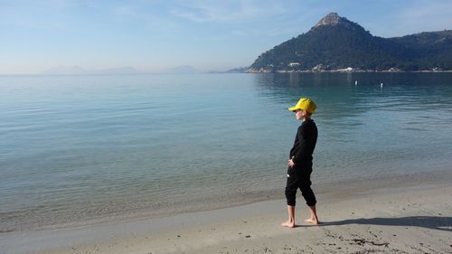 Full length of man on beach against sky