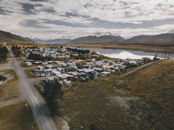 Lake clearwater village with the southern alps in the background. nz