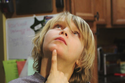 Portrait of blond boy contemplating