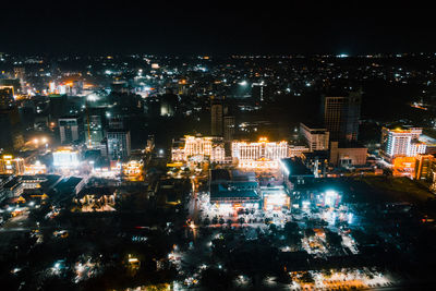 High angle view of illuminated buildings in city at night