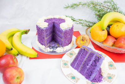 Close-up of cake and fruits on table during christmas