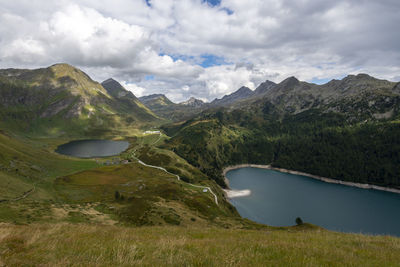 Scenic view of lake and mountains against sky