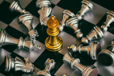 High angle view of chess pieces on board