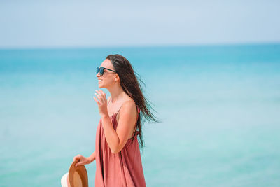 Woman wearing sunglasses against sky