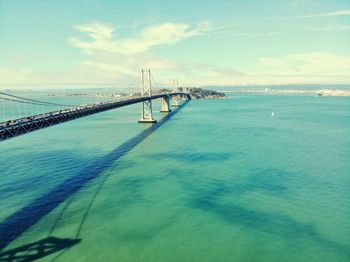 View of suspension bridge over sea