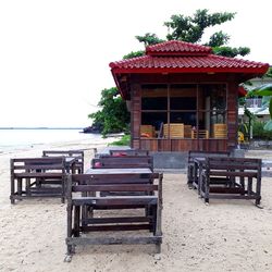 Chairs and table against sky