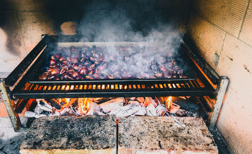 High angle view of food over barbecue grill