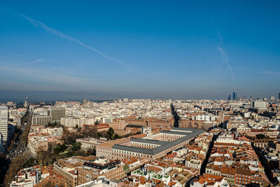 High angle shot of townscape against blue sky