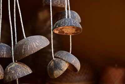Close-up of metal hanging on wood